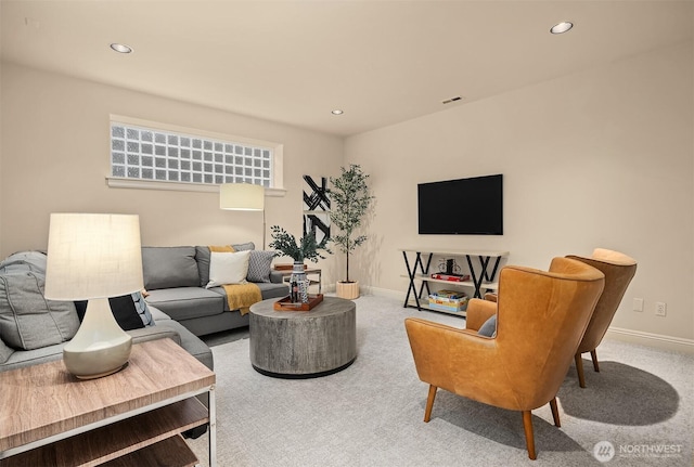 living room featuring recessed lighting, baseboards, and carpet