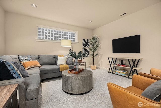 living room with carpet flooring, recessed lighting, and visible vents