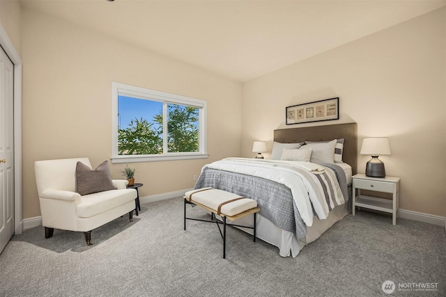 carpeted bedroom featuring baseboards