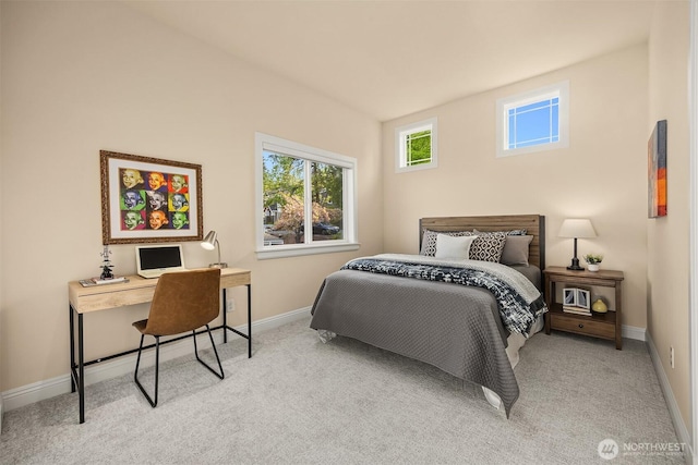 carpeted bedroom with baseboards