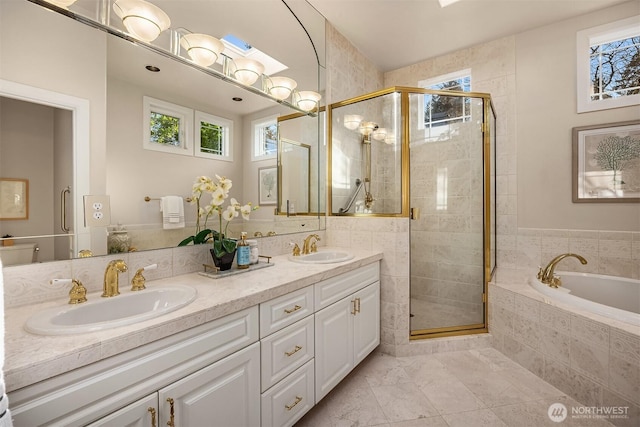 full bathroom featuring plenty of natural light, a sink, and a stall shower