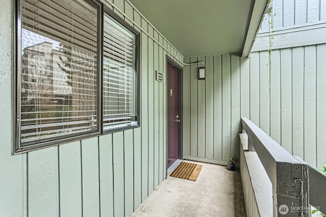 doorway to property featuring board and batten siding