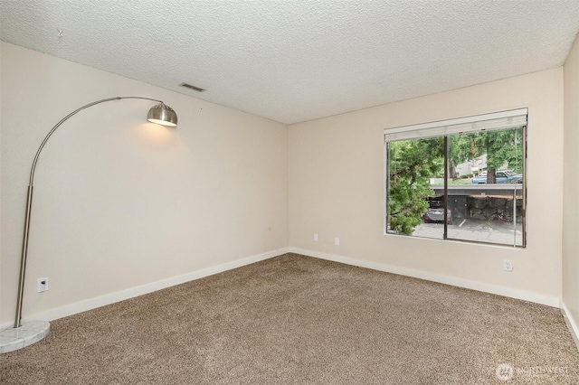 3518 109th Pl NE Unit 223, Bellevue, WA 98004 - carpeted spare room featuring a textured ceiling and baseboards