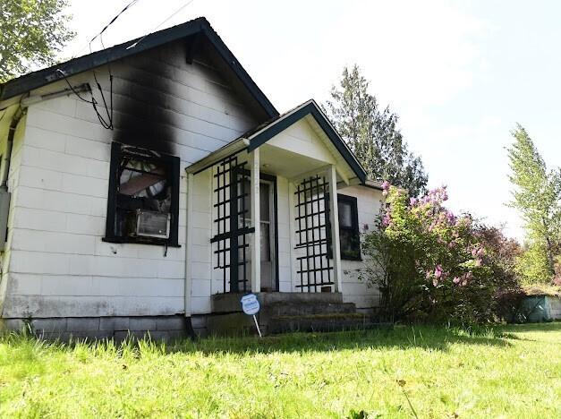 2522 Chesney Rd E, Tacoma, WA 98445 - view of home's exterior featuring a yard