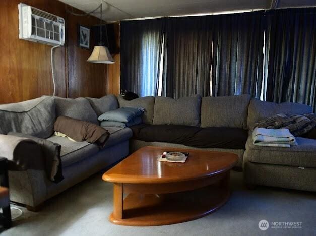 2522 Chesney Rd E, Tacoma, WA 98445 - carpeted living room featuring a wall unit AC