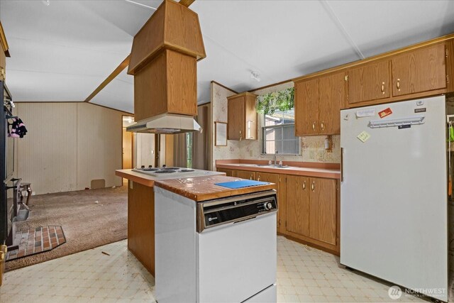 44222 179th Pl SE, Gold Bar, WA 98251 - kitchen with white appliances, light floors, lofted ceiling, brown cabinetry, and a sink