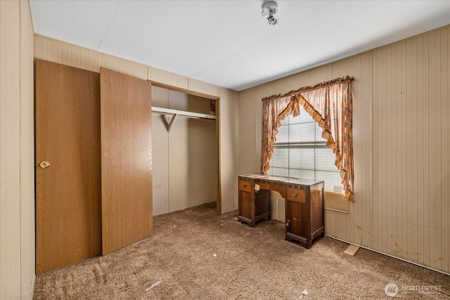44222 179th Pl SE, Gold Bar, WA 98251 - unfurnished bedroom featuring a closet, carpet flooring, and wooden walls