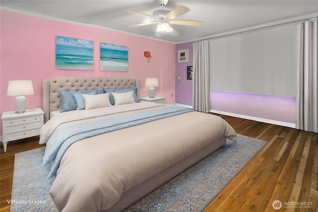 bedroom featuring baseboards, ceiling fan, ornamental molding, and wood finished floors