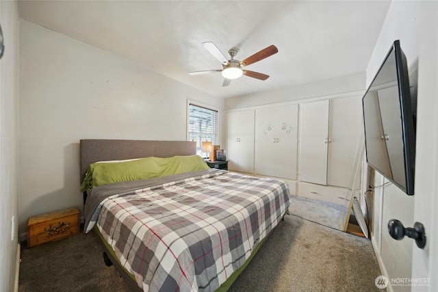 carpeted bedroom with ceiling fan and a closet