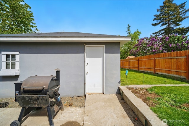 view of outdoor structure with fence