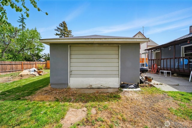 exterior space with a storage unit and fence