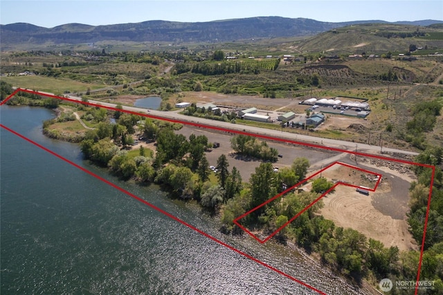 bird's eye view featuring a water and mountain view