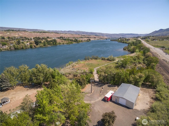bird's eye view featuring a water and mountain view