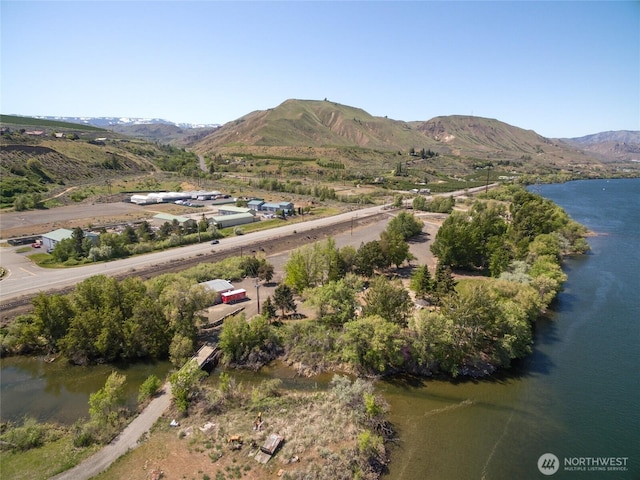 birds eye view of property featuring a water and mountain view