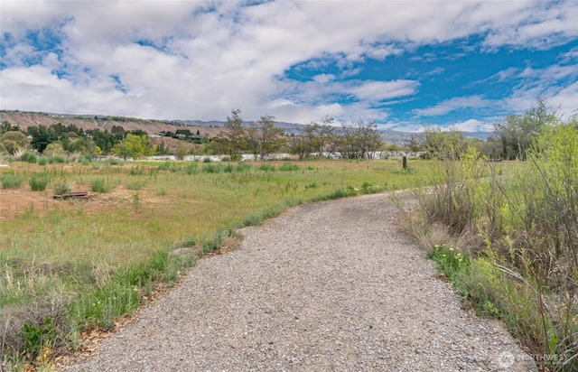 exterior space featuring a rural view and a mountain view