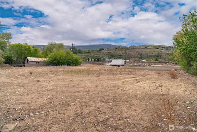 exterior space with a mountain view and a rural view