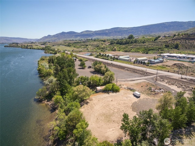 aerial view featuring a water and mountain view