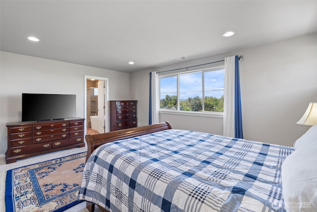 bedroom featuring carpet floors, recessed lighting, and connected bathroom