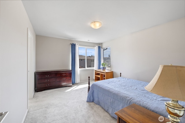 bedroom with carpet floors and baseboards