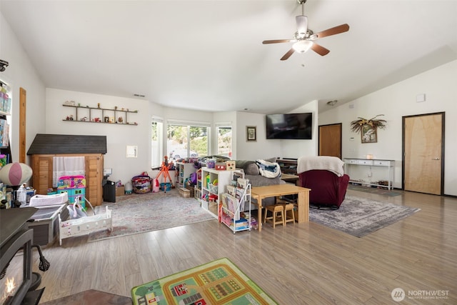 29304 39th Ave E, Graham, WA 98338 - living area with a ceiling fan, wood finished floors, and lofted ceiling