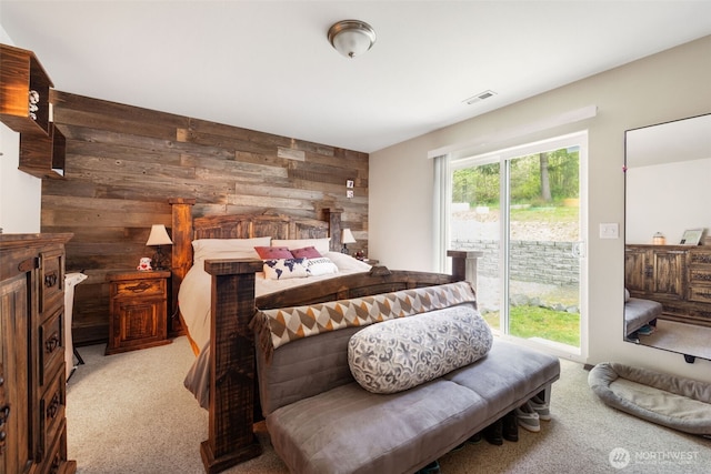 29304 39th Ave E, Graham, WA 98338 - bedroom with access to outside, wood walls, visible vents, and carpet