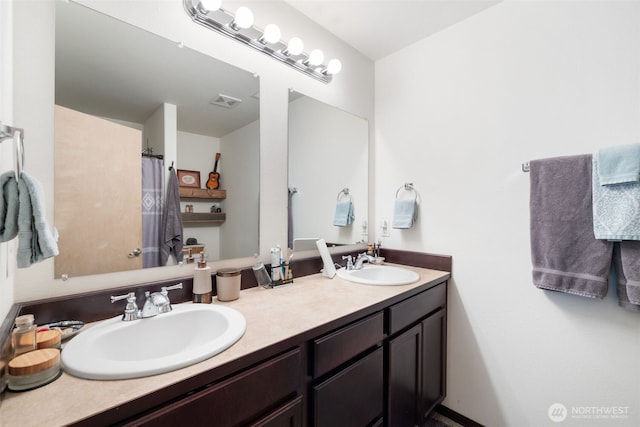 29304 39th Ave E, Graham, WA 98338 - full bathroom featuring a sink, a shower with shower curtain, double vanity, and visible vents