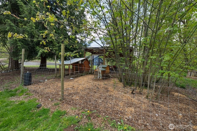 29304 39th Ave E, Graham, WA 98338 - view of yard featuring fence, exterior structure, an outbuilding, and central AC