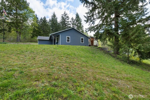 29304 39th Ave E, Graham, WA 98338 - rear view of property with a lawn