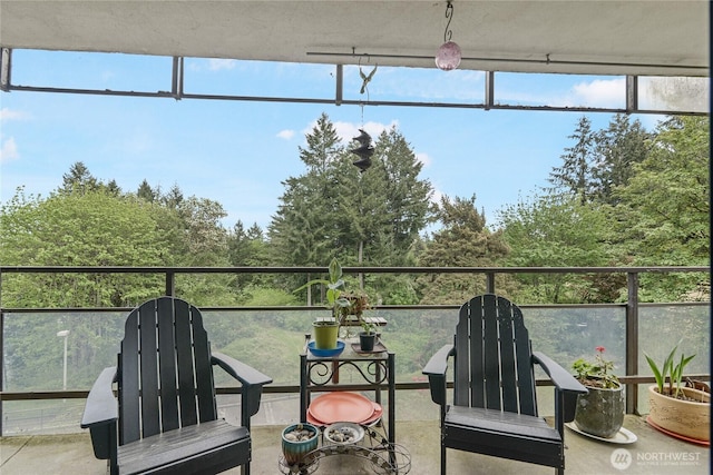 sunroom featuring concrete floors
