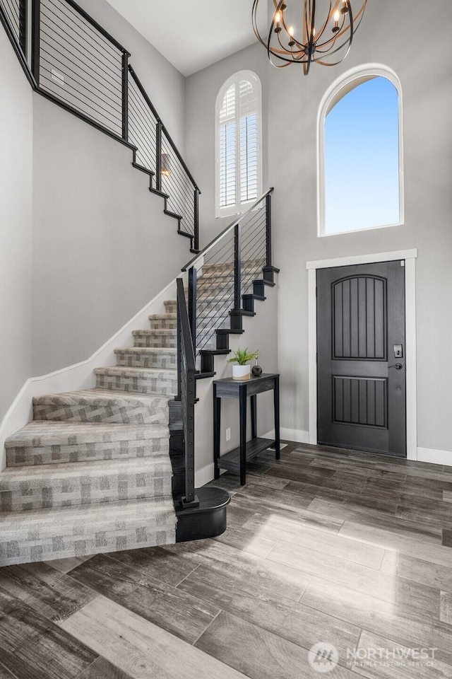 1614 W 51st Ave, Kennewick, WA 99337 - entrance foyer featuring baseboards, stairs, a high ceiling, and a notable chandelier