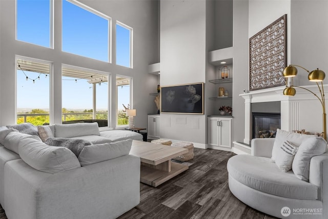 1614 W 51st Ave, Kennewick, WA 99337 - living area with a high ceiling, dark wood-type flooring, and a wealth of natural light