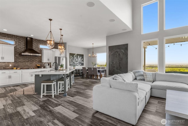 1614 W 51st Ave, Kennewick, WA 99337 - living area with dark wood-type flooring and a notable chandelier