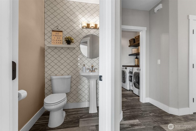 1614 W 51st Ave, Kennewick, WA 99337 - half bath with baseboards, toilet, wood finished floors, and washer and clothes dryer