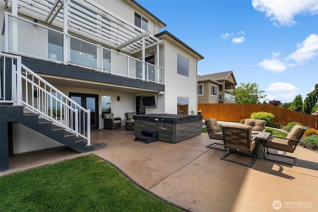 1614 W 51st Ave, Kennewick, WA 99337 - view of patio featuring a hot tub, stairway, fence, and a balcony