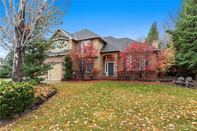 traditional home featuring a garage, a front lawn, a chimney, brick siding, and a shingled roof