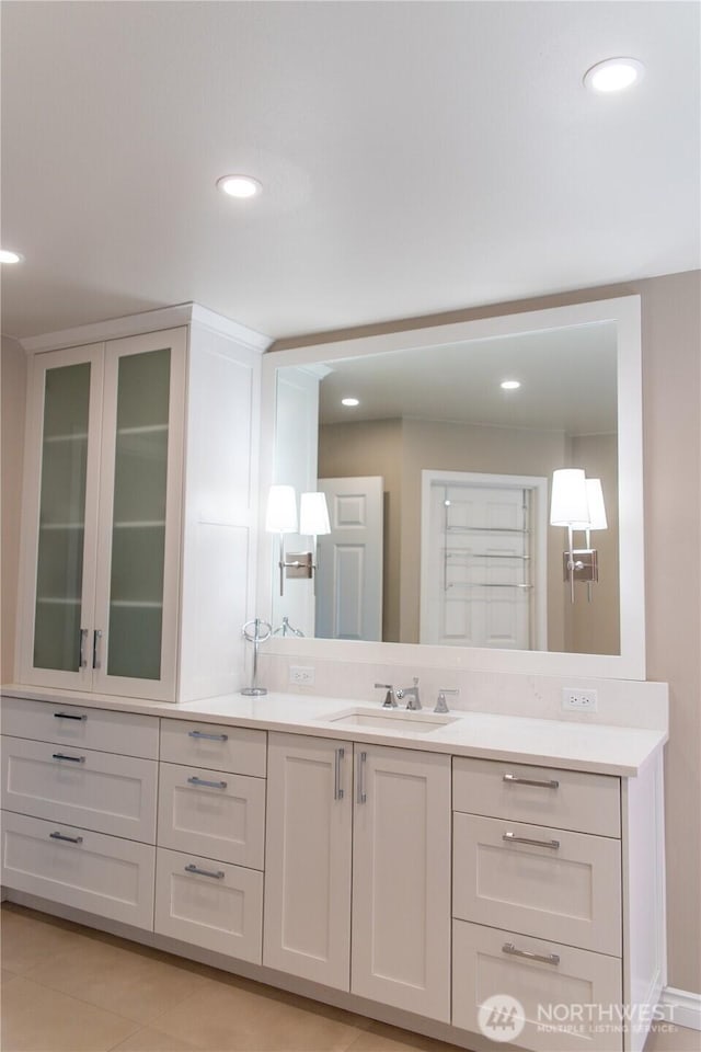 bathroom with vanity, tile patterned floors, and recessed lighting