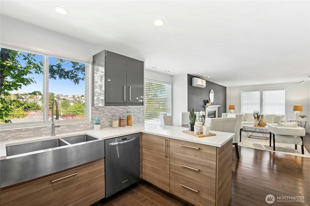 3003 E Pine St, Seattle, WA 98122 - kitchen featuring dishwasher, a sink, a peninsula, light countertops, and recessed lighting