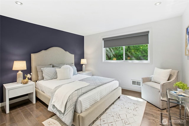 3003 E Pine St, Seattle, WA 98122 - bedroom with recessed lighting, wood finished floors, and baseboards