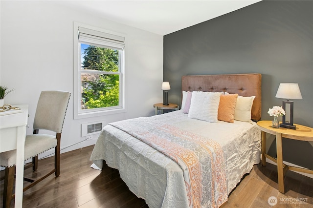 3003 E Pine St, Seattle, WA 98122 - bedroom featuring wood finished floors
