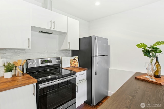 3003 E Pine St, Seattle, WA 98122 - kitchen with stainless steel appliances, butcher block countertops, white cabinetry, tasteful backsplash, and under cabinet range hood