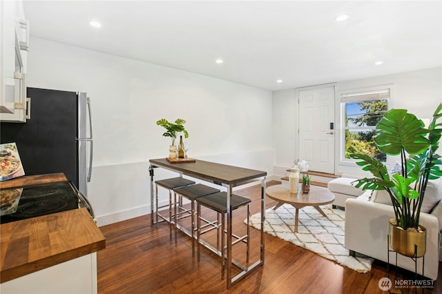 3003 E Pine St, Seattle, WA 98122 - dining space featuring dark wood finished floors, baseboards, and recessed lighting