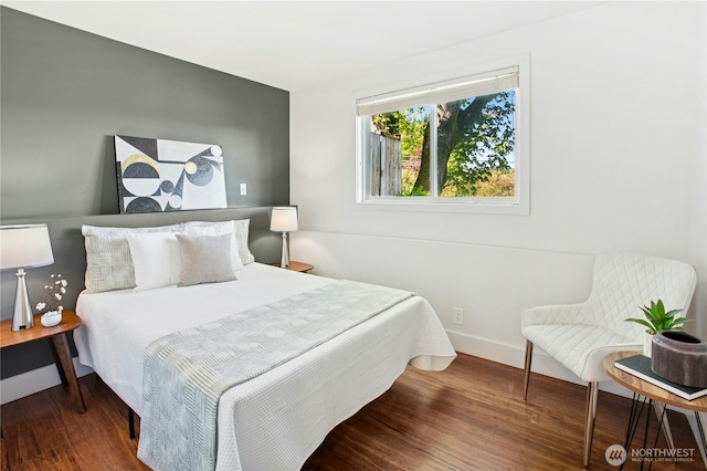3003 E Pine St, Seattle, WA 98122 - bedroom featuring wood finished floors and baseboards