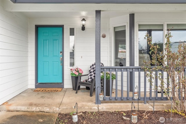 property entrance with covered porch