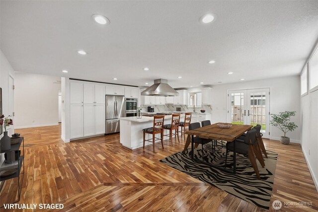 18 SE 18th St, Battle Ground, WA 98604 - dining room featuring baseboards, light wood-style floors, and recessed lighting