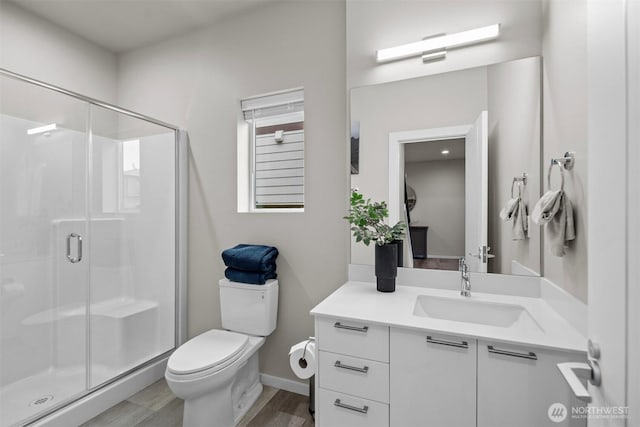 33455 Holly Ave SE, Black Diamond, WA 98010 - bathroom featuring vanity, toilet, baseboards, wood finished floors, and a stall shower