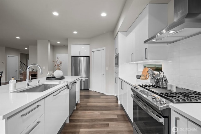 33455 Holly Ave SE, Black Diamond, WA 98010 - kitchen with modern cabinets, wall chimney range hood, white cabinets, a sink, and appliances with stainless steel finishes