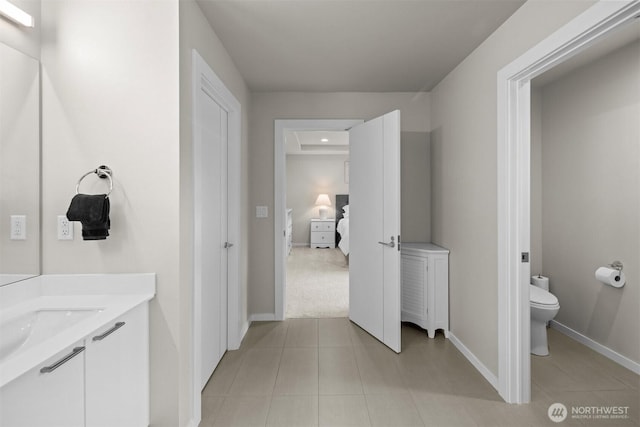 33455 Holly Ave SE, Black Diamond, WA 98010 - bathroom with baseboards, tile patterned floors, toilet, and vanity