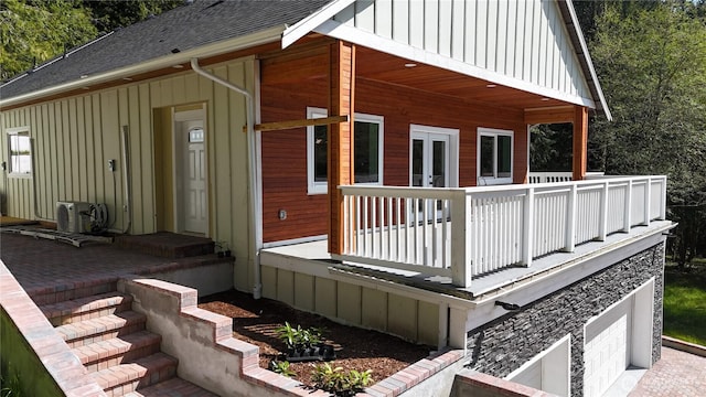 15941 Glenwood Rd SW, Port Orchard, WA 98367 - exterior space featuring a shingled roof, board and batten siding, and an attached garage