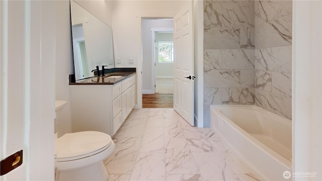 15941 Glenwood Rd SW, Port Orchard, WA 98367 - bathroom featuring vanity, a washtub, toilet, and marble finish floor
