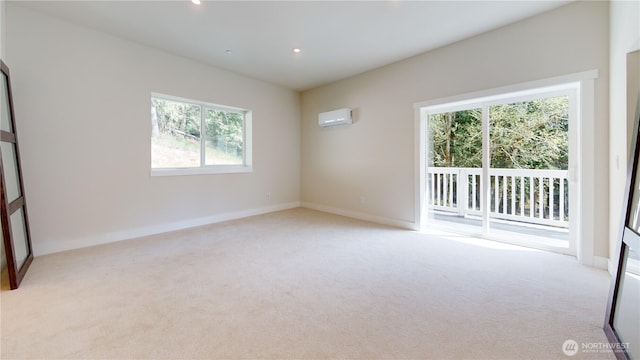 15941 Glenwood Rd SW, Port Orchard, WA 98367 - unfurnished room with baseboards, a wall unit AC, recessed lighting, and light colored carpet